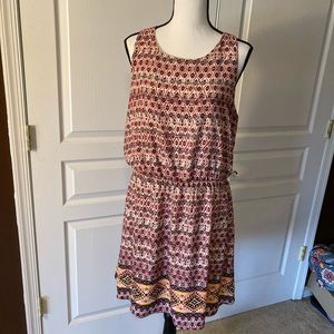 Xhiliration dress. Fun print with tie back
